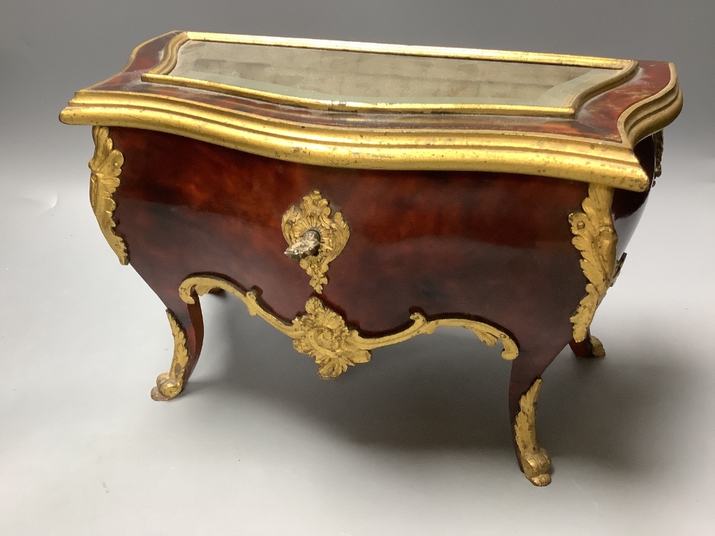 A tortoiseshell and ormolu jewellery casket, modelled in the form of a French commode and a Victorian brass-mounted walnut tea caddy, largest 31cm